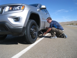 me exhaning the flat tire in Death valley